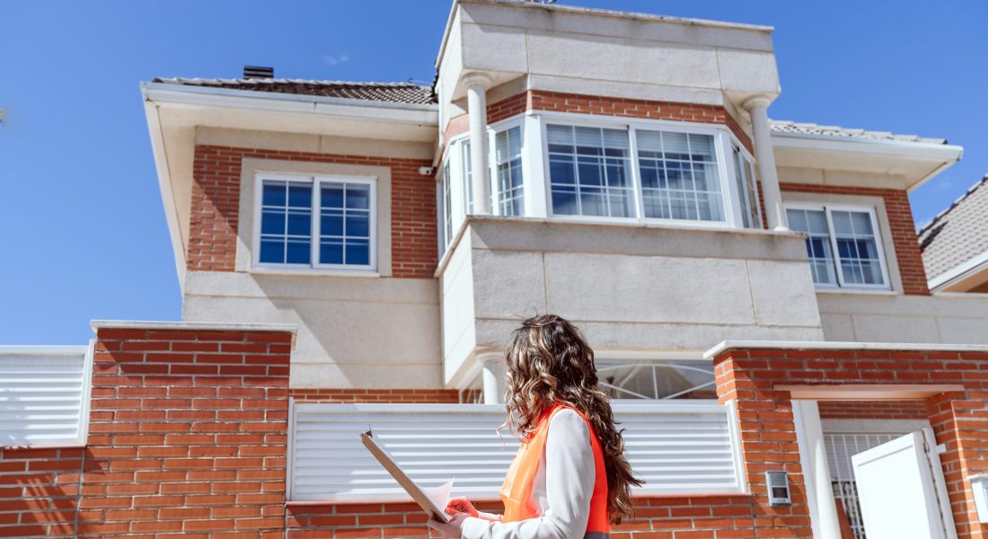 inspector or architect professional woman checking house at construction site. Home improvement inspector or architect professional woman checking house at construction site. Home improvement